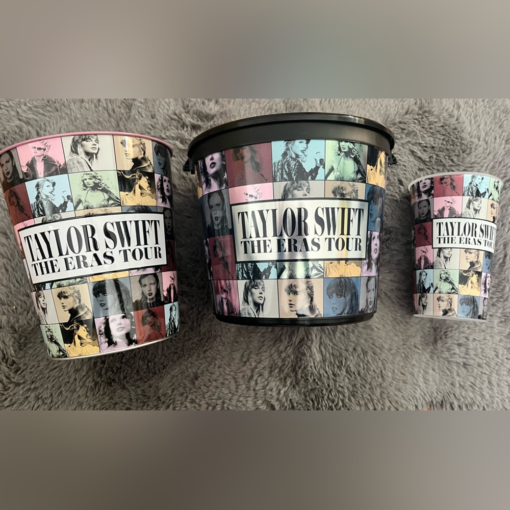Taylor Swift Eras Tour movie set with popcorn bucket, tin, and a cup